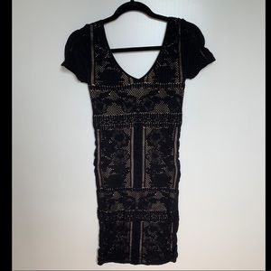 Bebe black over nude dress